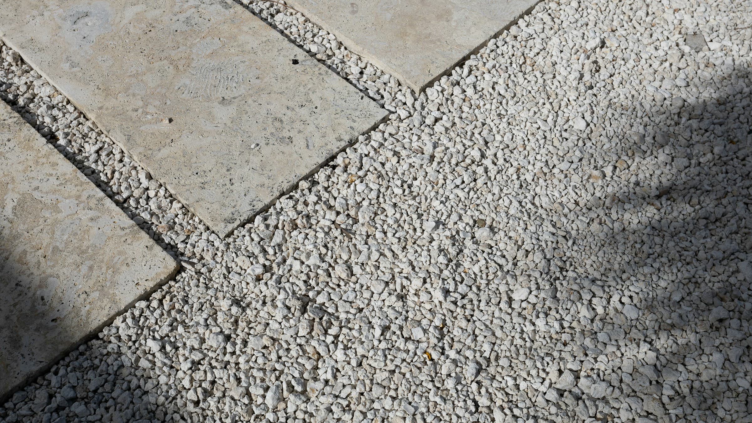 Finished garden path with large pavers and light gravel